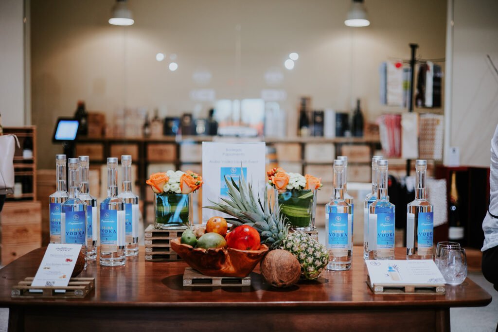 Refreshing Cocktails with Aruba VodkaBodegas Papiamento Aruba Rum, garnished with fresh tropical fruits.